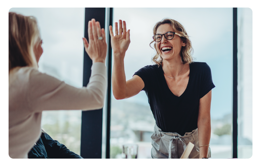 two women sharing a high-five